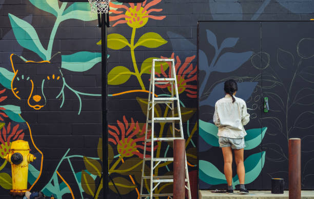 lady painting wall in Dubai